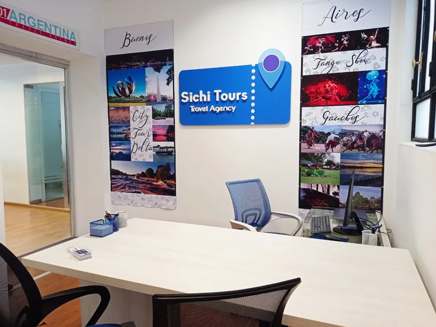 The reception desk at the 01Argentina office in Buenos Aires, under the Sichi Tours sign