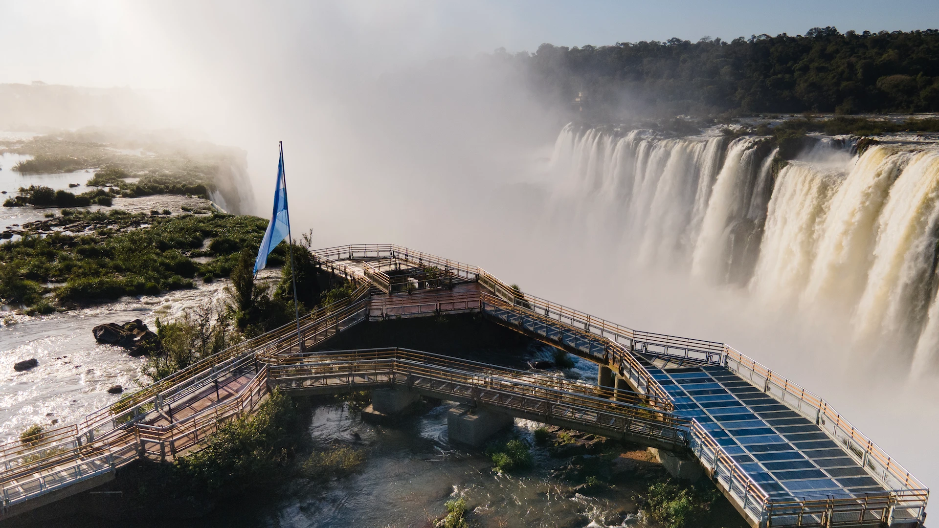 Visitors on the Devil's Throat balcony above the mist at Iguazu Falls
