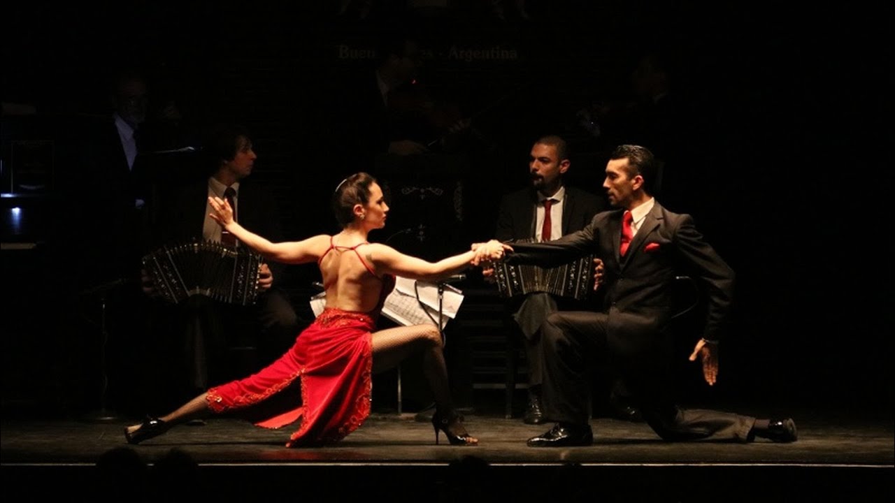 Tango dancers and musicians performing at a dinner show in Buenos Aires