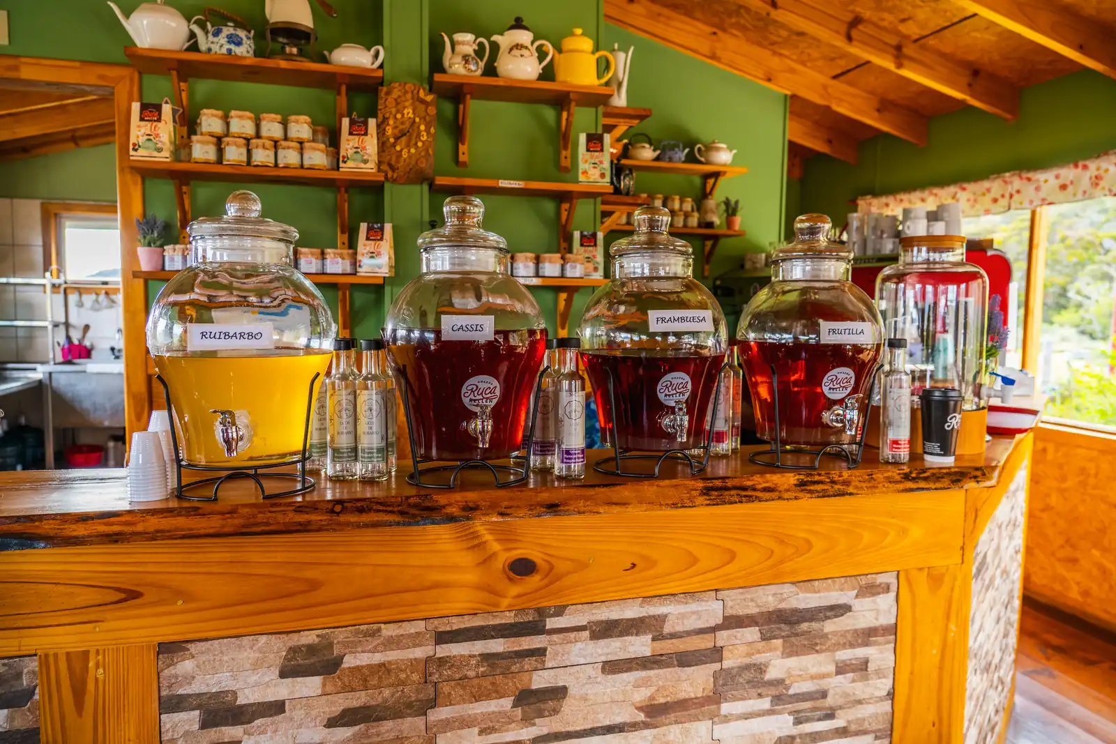 Jars of preserves and infusions on the counter of the farm shop