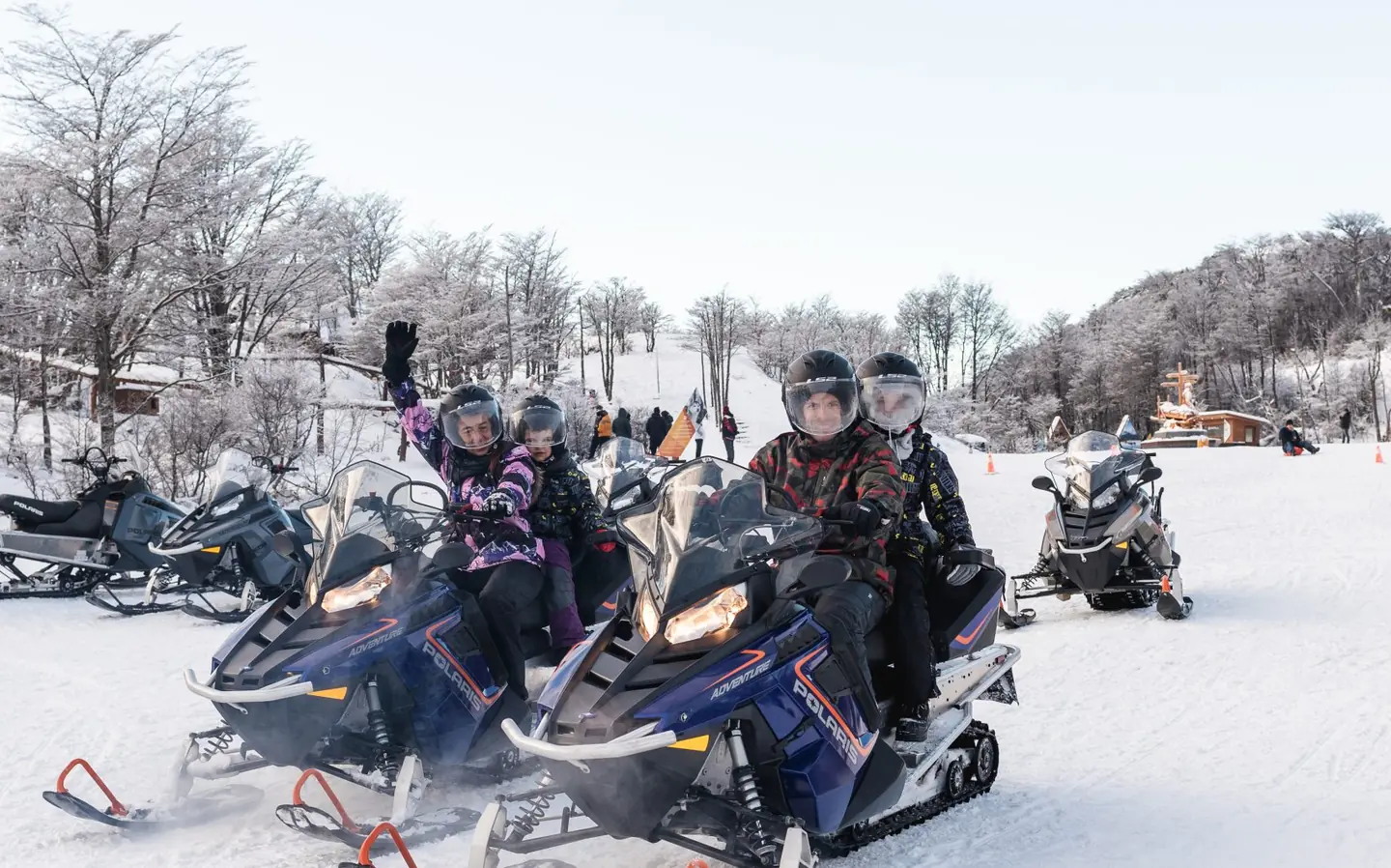 Families on snowmobiles at the base in the Tierra Mayor valley, Ushuaia